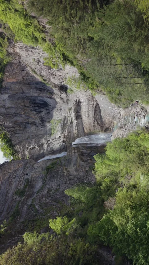 Rotating inception drone view of Sorrosal Waterfall in the Pyrenees Stock Footage 341529710