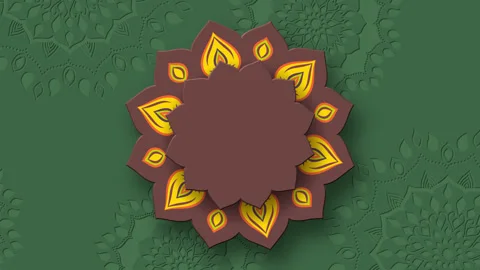 Rotating Indian Rangoli with burning diya. Stock Footage 248349128