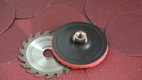 Rotating industrial tools - sanding discs and circular saw Stock Footage 99019918