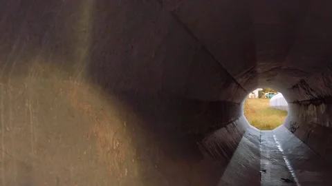 Rotating inside View of Round Metal Tapered Electrical Power Pole  section  with Stock Footage 263902503