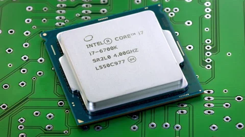 Rotating intel cpu on printed circuit board zoom Video stock 65778956