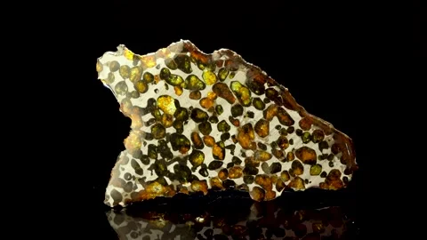 Rotating Of An Iron Meteorite. black background on a mirror base. general pla Vidéo 231556778