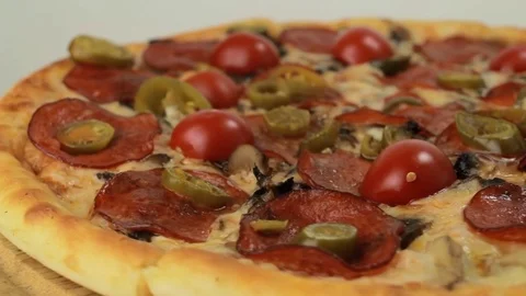 Rotating italian pizza with pepperoni Stock Footage 80649202