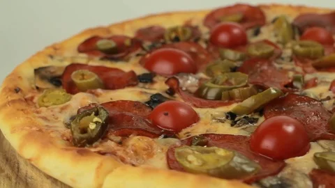 Rotating italian pizza with pepperoni Stock Footage 80649248