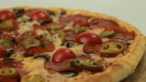 Rotating italian pizza with pepperoni Stock Footage 80649298