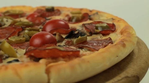 Rotating italian pizza with pepperoni Stock Footage 80649345
