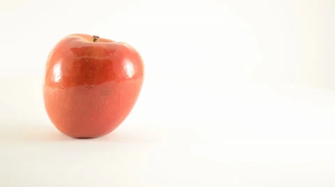 Rotating Jazz Apple Against White - Dolly Right Stock Footage 24834267