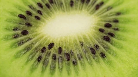 Rotating kiwi slice, macro. Fresh and healthy organic food Stock Footage 74479999