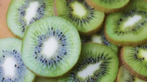 Rotating kiwi slices Stock Footage 238481513