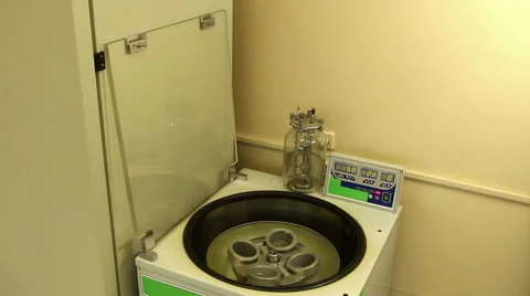 The rotating laboratory centrifuge is slowed down and stops Stock Footage 58399652