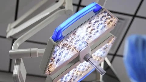 Rotating lamp switched on in the surgery room.  Stock Footage 293240732