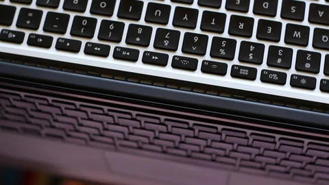 Rotating Laptop Keyboard and Reflections on the Screen Stock Footage 89795105