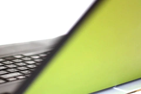 Rotating laptop seamlessly loopable, isolated on white Stock Footage