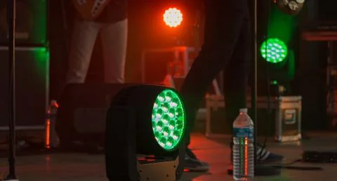 Rotating LED projector illuminates the public in green Stock Photos
