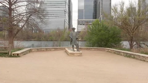 Rotating left to right around Stevie Ray Vaughn Statue In Austin, TX Stock Footage 173341126