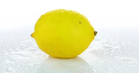 Rotating lemon on isolated white background	 Stock Footage 102261544