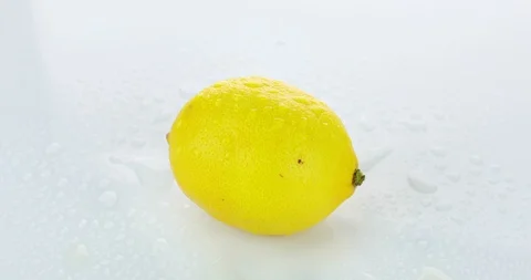 Rotating lemon on isolated white background	 Stock Footage 102261979