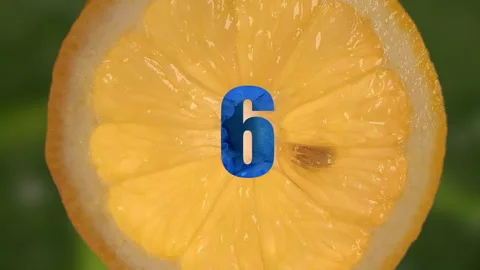 Rotating Lemon Slice with Animated Clock Numbers in 60p Stock Footage 336962806