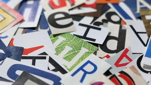 Rotating letters cut from magazines - abstract background Stock Footage 124869041