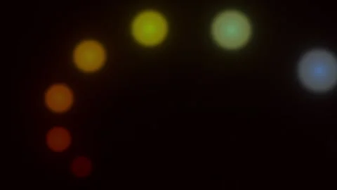 Rotating light dots on a black background 動画素材 320148383