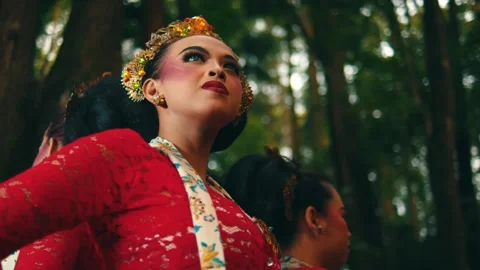 Rotating Low Angle Shot of Javanese Women Looking Up in Forest Stock Footage 263947235
