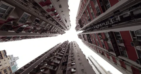 Rotating low angle view of old high rise residential towers in Kennedy Town, HK Stock Footage 309359860