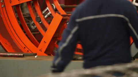 Rotating Machine with a Worker Walking Stock Footage 34265371