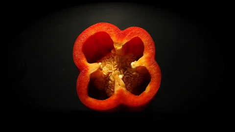 Rotating macro lens Top View of Red Pepper Slice in 50p Stock Footage 337642829
