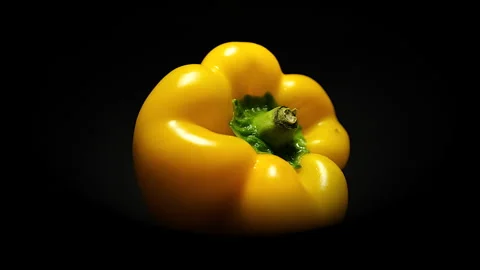 Rotating macro lens Top View of Yellow Pepper in 50p Stock Footage 337642860