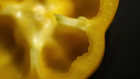 Rotating with Macro lens Top View of Yellow Pepper Slice in 50p Stock Footage 337643022