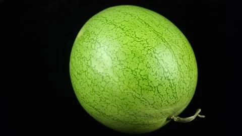 Rotating Marble Watermelon On A Black Background. Video stock 162256988