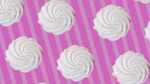 Rotating marshmallow on a pink striped background. Stock Footage 231397385
