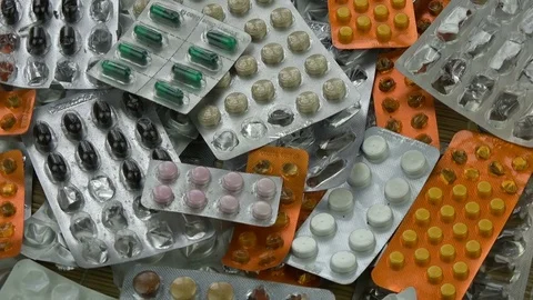 Rotating medication blisters of tablets and pills background Stock Footage 79371609