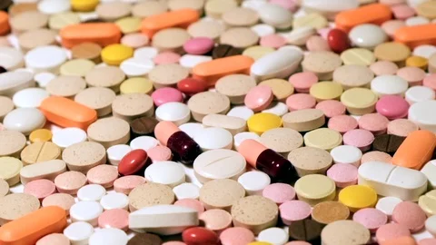 Rotating medication tablets and pills. Medicine concept background Video stock 122078923
