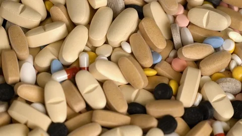 Rotating medication tablets and pills. Medicine concept background Stock Footage 123108820