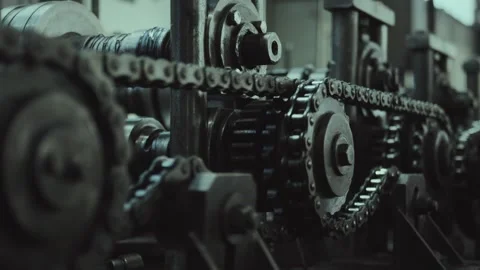 Rotating metal gears and chains of an industrial machine Stock Footage 318188546
