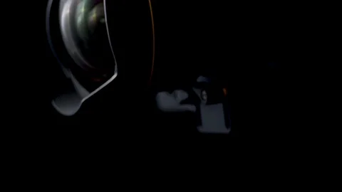 Rotating movement of a DSRL camera and a ultra wide angle lens using a gimbal Stock Footage 108516545