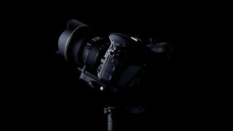 Rotating movement of a Nikon D750 DSRL camera using a Zhiyun Crane-2 stabilizer Stock Footage 108519717