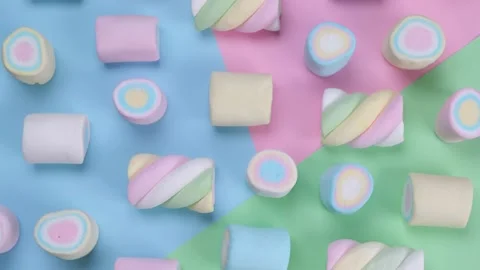 Rotating multicolored chewy marshmallows on a multicolored background, the Stock Footage 201264251