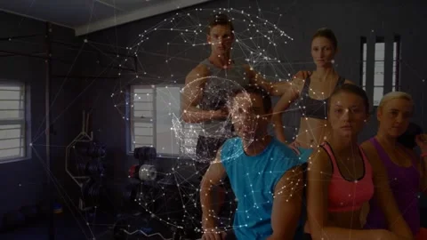 Rotating network sphere spurring trainers posing for promo in small gym, workout Stock Footage 334034972