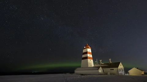 Rotating night sky above the lighthouse Stock Footage 250420395