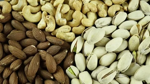 Rotating Nuts Almonds Hazelnuts And Cashews. Video stock 154157394