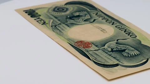 A rotating old 1000 yen bill Stock Footage 336476980