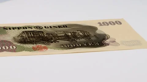A rotating old 1000 yen bill Stock Footage 336491218