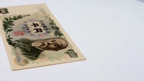 A rotating old 1000 yen bill Stock Footage 336505105