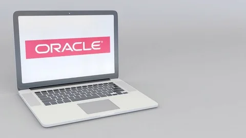 Rotating opening and closing laptop with Oracle Corporation logo. Computer Stock Footage 73099209