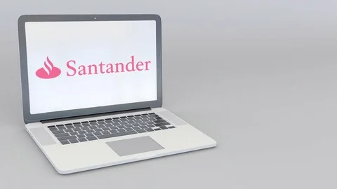 Rotating opening and closing laptop with Santander Serfin logo. Computer Stock Footage 73100756