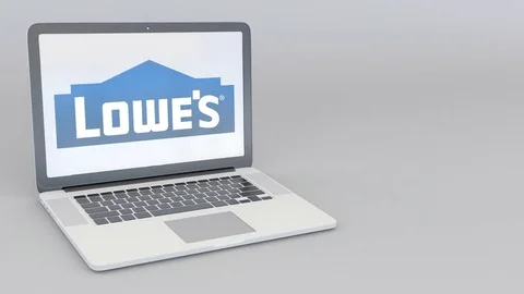 Rotating opening and closing laptop with Lowe's logo. Computer technology Stock Footage