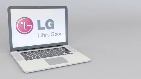 Rotating opening and closing laptop with LG Corporation logo. Computer Stock Footage