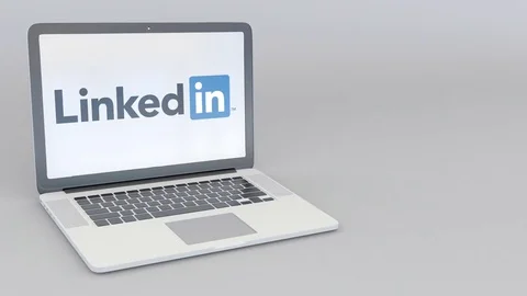Rotating opening and closing laptop with LinkedIn logo. Computer technology Stock Footage 73102842